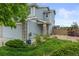 Charming two-story home with stone accents, a well-maintained lawn, and a delightful curb appeal for lasting impressions at 5864 Turnstone Pl, Castle Rock, CO 80104