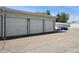 Garage with concrete driveway and parked cars at 710 S Clinton St # 1A, Denver, CO 80247