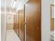 Hallway with numbered doors and tile flooring at 710 S Clinton St # 1A, Denver, CO 80247