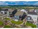 Aerial view of a home showcasing its backyard, deck, and surrounding neighborhood with mountain views at 8132 Mt Harvard Rd, Littleton, CO 80125
