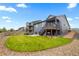 Beautifully landscaped backyard with a well-manicured lawn and a cozy patio area for outdoor enjoyment at 8132 Mt Harvard Rd, Littleton, CO 80125