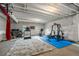 Finished basement featuring workout area with gym equipment and pull-up bar at 8132 Mt Harvard Rd, Littleton, CO 80125