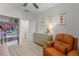 Bright Bedroom features a comfortable orange chair, changing table, closet and whimsical wall decor at 8132 Mt Harvard Rd, Littleton, CO 80125