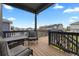 Back deck with black railings and patio furniture, offering neighborhood views at 8132 Mt Harvard Rd, Littleton, CO 80125