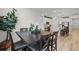 Dining room with table set for six, offering a glimpse of the kitchen and an inviting atmosphere at 8132 Mt Harvard Rd, Littleton, CO 80125