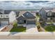 Charming single-Gathering home boasting manicured lawn, stone accents, and a two-car attached garage at 8132 Mt Harvard Rd, Littleton, CO 80125