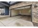 Open two-car garage featuring a door to the main house at 8132 Mt Harvard Rd, Littleton, CO 80125