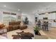 Bright and airy living room with hardwood floors, open floorplan, and seamless transition to the kitchen at 8132 Mt Harvard Rd, Littleton, CO 80125