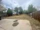 A spacious backyard featuring a concrete patio and a well-maintained fence at 2771 W 1St Ave, Denver, CO 80219