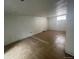 Unfinished basement with tile flooring and a single window to provide some natural light at 2771 W 1St Ave, Denver, CO 80219