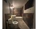 Small bathroom featuring a toilet, sink, and a shower/bath at 2771 W 1St Ave, Denver, CO 80219