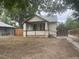 A charming single-story house with a covered porch and a cozy, welcoming facade at 2771 W 1St Ave, Denver, CO 80219