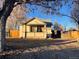 Charming home featuring a welcoming front porch and a well-maintained yard in a quiet neighborhood at 2771 W 1St Ave, Denver, CO 80219