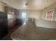 A functional kitchen featuring laminate counters, neutral-toned walls, and a vintage refrigerator at 2771 W 1St Ave, Denver, CO 80219