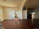 A spacious living room with hardwood floors and an open layout leading to the kitchen at 2771 W 1St Ave, Denver, CO 80219