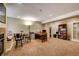 Spacious finished basement area with fireplace and desk with computer at 237 Dayton St, Denver, CO 80230