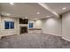 Finished basement with stone fireplace, bench seating, and windows at 237 Dayton St, Denver, CO 80230