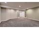 Spacious finished basement with carpet and french doors at 237 Dayton St, Denver, CO 80230
