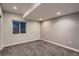 Finished basement with carpet flooring and natural light at 237 Dayton St, Denver, CO 80230