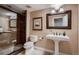 Bathroom featuring an open shower and traditional pedestal sink at 237 Dayton St, Denver, CO 80230