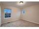 Bedroom with neutral walls, carpet flooring, and window views offering natural light at 237 Dayton St, Denver, CO 80230