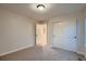 Bedroom features carpet, closet and door leading to a hallway; light bright and clean at 237 Dayton St, Denver, CO 80230