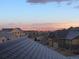 Scenic view of a neighborhood with the city skyline and mountains in the background at sunset or sunrise at 237 Dayton St, Denver, CO 80230