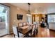 Elegant dining room with a large table, modern lighting, and seamlessly connects to the adjacent living area at 237 Dayton St, Denver, CO 80230