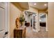 Hallway with beautiful floral arrangement and doorways leading to other rooms at 237 Dayton St, Denver, CO 80230