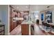 Kitchen with granite countertops and stainless steel appliances, opens to dining area at 237 Dayton St, Denver, CO 80230