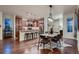 Modern kitchen with granite countertops and stainless appliances overlooks dining area at 237 Dayton St, Denver, CO 80230