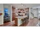 Kitchen with an island, stainless steel appliances, and wooden cabinets at 237 Dayton St, Denver, CO 80230