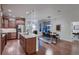 Open-concept kitchen with granite countertops, stainless steel appliances, and a dining area at 237 Dayton St, Denver, CO 80230