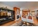 Cozy living area with fireplace, flatscreen tv, and adjacent kitchen in a well-lit space at 237 Dayton St, Denver, CO 80230
