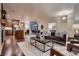 Open-concept living room seamlessly connects the kitchen and dining areas at 237 Dayton St, Denver, CO 80230