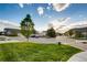 Scenic neighborhood street featuring well-maintained lawns and beautiful homes with tree-lined street at 237 Dayton St, Denver, CO 80230