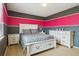 Stylish bedroom showcasing a white bed frame with patterned bedding and modern furnishings at 2948 Open Sky Way, Castle Rock, CO 80109
