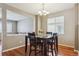 Dining room with hardwood floors and an open view into the living room at 2948 Open Sky Way, Castle Rock, CO 80109