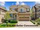 Charming two-story home with a manicured lawn, inviting front porch, and two-car garage at 2948 Open Sky Way, Castle Rock, CO 80109