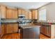 Well-equipped kitchen with stainless steel appliances and a functional center island at 2948 Open Sky Way, Castle Rock, CO 80109