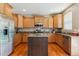 Spacious kitchen with stainless steel appliances and island for food preparation at 2948 Open Sky Way, Castle Rock, CO 80109