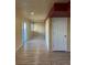 Finished basement featuring wood-look floors, recessed lighting, and a sliding glass door at 21742 E Lehigh Pl, Aurora, CO 80018