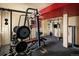 Fully equipped home gym in the basement with plenty of workout machines at 21742 E Lehigh Pl, Aurora, CO 80018