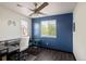 Bright bedroom featuring a ceiling fan, and large windows that bring in lots of natural light at 21742 E Lehigh Pl, Aurora, CO 80018