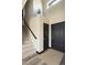 Inviting foyer with tiled floors, staircase and black doors at 21742 E Lehigh Pl, Aurora, CO 80018