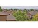 Expansive rooftop view showcases the neighborhood's tree-lined streets and distant mountain range at 21742 E Lehigh Pl, Aurora, CO 80018