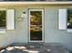 Charming house front door with sidelights, an address number, and a welcome mat at 1941 S Dexter St, Denver, CO 80222