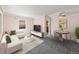 Bright living room with neutral tones, gray carpet, and comfortable seating at 1941 S Dexter St, Denver, CO 80222