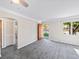 Living room with gray carpet, neutral paint, and an open doorway at 1941 S Dexter St, Denver, CO 80222