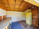 Inside of the shed showing desk, storage cabinet and plywood flooring at 1941 S Dexter St, Denver, CO 80222